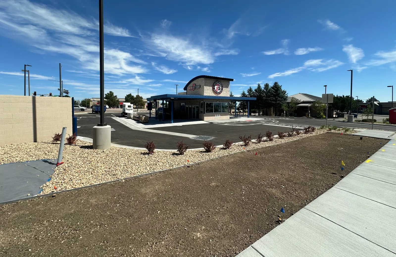 7 Brew Coffee drive-thru building at Castle Pines Parkway and Debbie Lane, Castle Pines, CO, signage installed and lot paved before opening