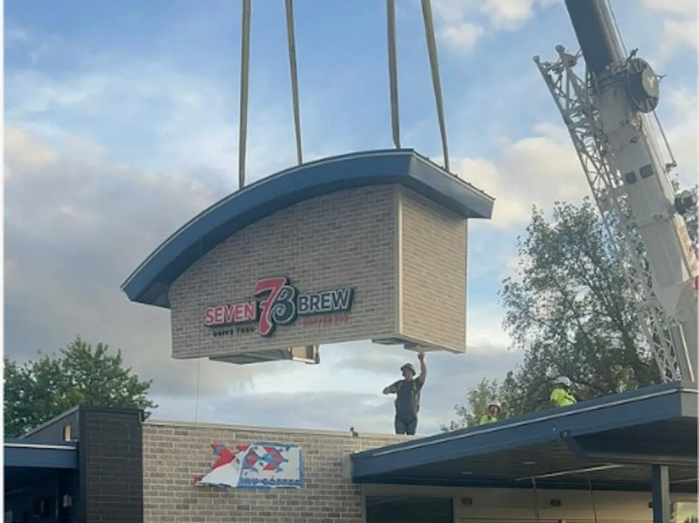 Crane lowering a 7 Brew Coffee drive-thru building onto the site at 3919 Colonel Glenn Highway in Beavercreek, Ohio